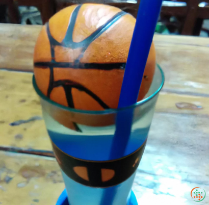 A basketball in a cup