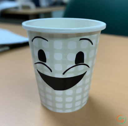 A cup with a face on it