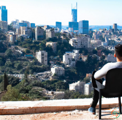 A person sitting on a ledge overlooking a city