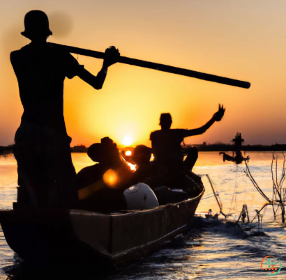 A silhouette of a person holding a gun and another man on a boat