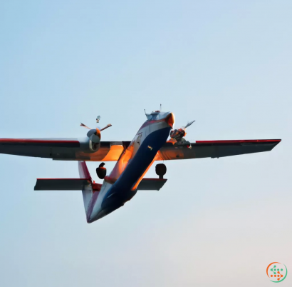 A red and blue airplane flying in the sky