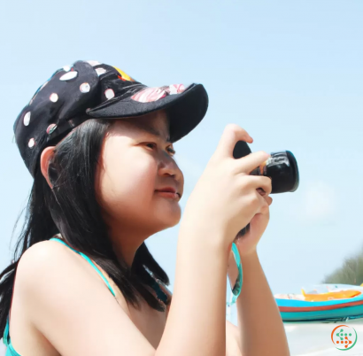 A woman taking a picture with a camera