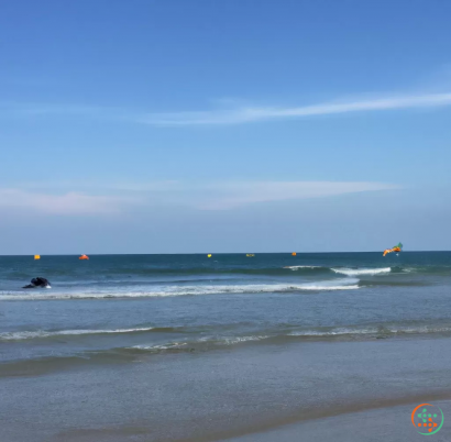 A beach with people in the water