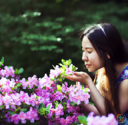 A woman smelling flowers