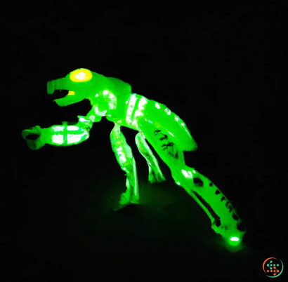 A green frog with glowing eyes