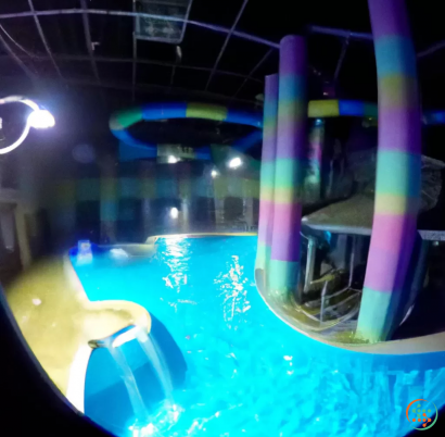 A pool with colorful lights