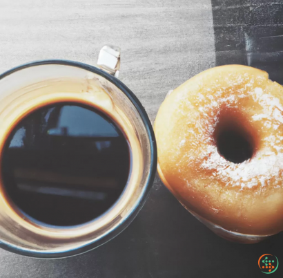 A donut and a mug of coffee