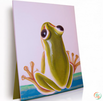 A frog on a white surface