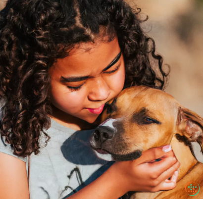 A person holding a dog