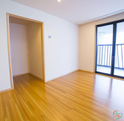 A room with a wood floor and a wood floor