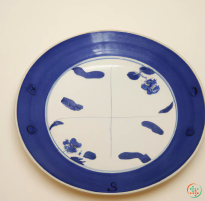 A blue plate with blue flowers