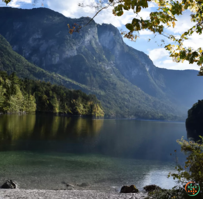 A lake with a mountain in the background