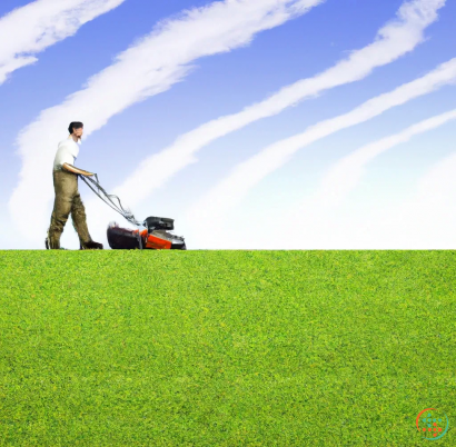 A man pulling a lawn mower