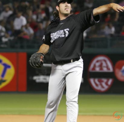 A baseball player throwing a ball