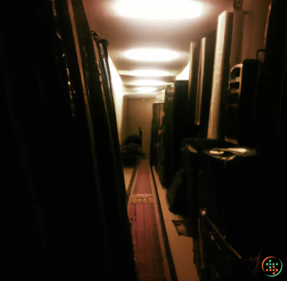 A hallway with a light on
