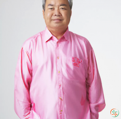 A man wearing a pink shirt