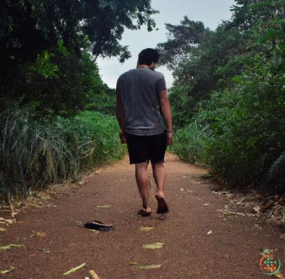 A man walking on a dirt path