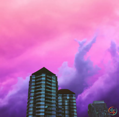 A group of buildings with a pink and purple sky above