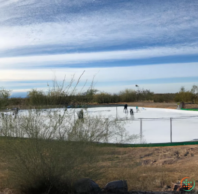 A group of people walking by a lake