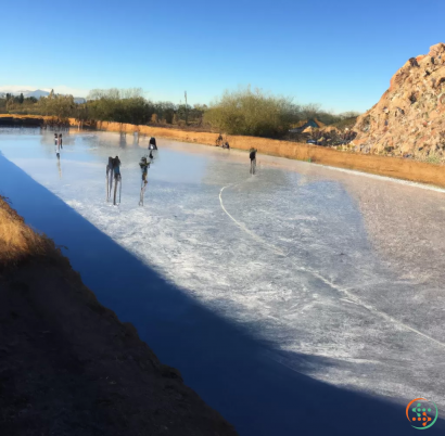 A group of people standing in a body of water