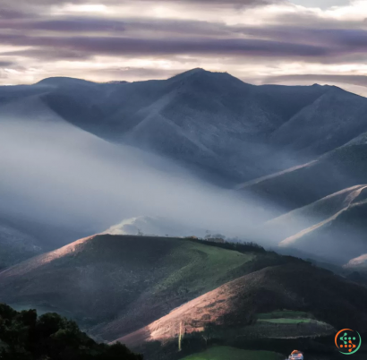 A mountain with clouds