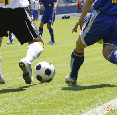 A person kicking a football ball