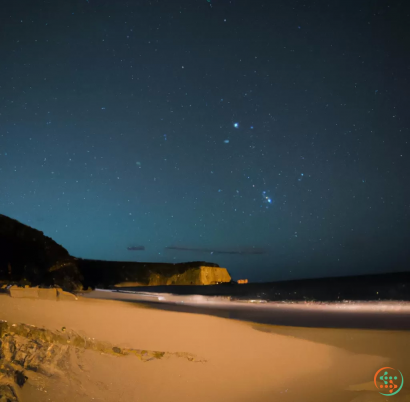 A snowy beach at night