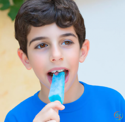 A boy eating a popsicle