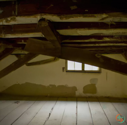 A room with a window and a wood floor