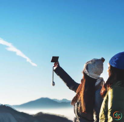 A couple of people looking through binoculars