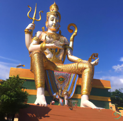 A statue of a person holding a staff and a crown