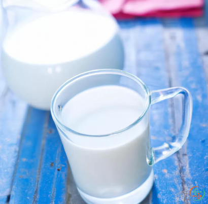 A white cup and a white pitcher