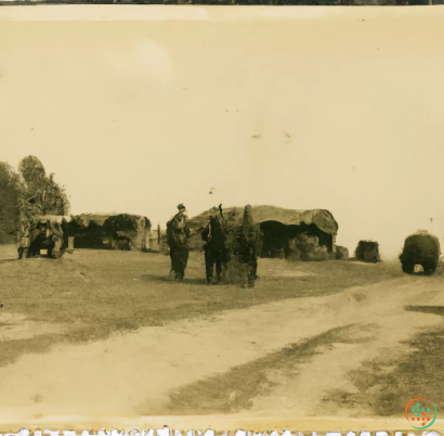 A group of soldiers standing in front of a group of tanks