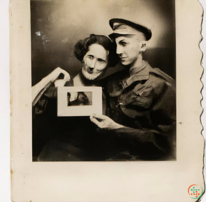 A man and woman holding a picture